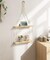 Beige Macrame Wall Hanging Shelf – 2-Tier Boho Floating Shelves with Cotton Rope, Perfect for Plants, Photos, Tissues, Towels, and Rustic Home Décor in the Living Room, Bedroom, Bathroom, or Hallway.